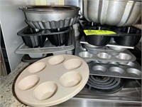 Large group of baking pans, muffin pans, bundt pan