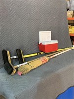 Curling brooms, Coleman Lunchbox cooler.