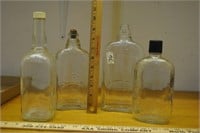 4 vintage whisky bottles