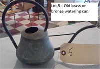 Old brass or bronze watering can