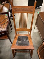 Antique rocking chair with broken bottom