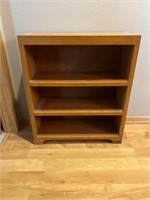 Wooden bookshelf. Measures 27 X 10 X 31