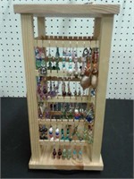 Pierced Earings on wood display rack