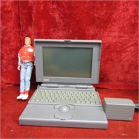 Macintosh PowerBook & doll.