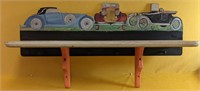 Hand painted wooden shelf with dowels for hanging