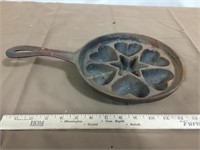 Vintage cast iron muffin pan with handle