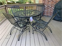 IRON OUTDOOR 42 “ TABLE W/ 4 ROCKING CHAIRS