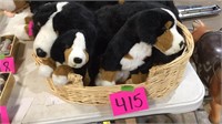 Stuffed dog with puppies in basket
