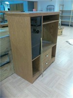 Entertainment center with shelves and drawers.