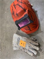 Welding gloves and red face shield