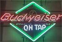 Neon Budweiser “On Tap” beer advertisement with