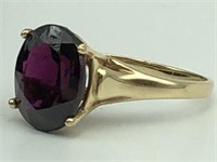 14k ladies ring with oval Garnet