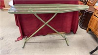 Metal ironing board without cover.
