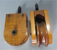 (2) Vintage wood pullies.