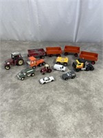 Toy tractors and wagons, trucks and some cars