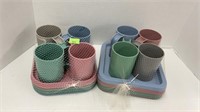 2 sets of plastic cups and plates. 8 cups, 8