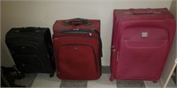 Red, Pink, Black Suit Cases