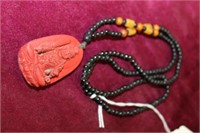 Necklace w/ carved red pendant