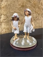 Take care of your sister figurine