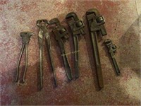 Pipe wrenches and fence tools