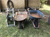 Two Wheelbarrows and a Hose Reel