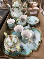 Tea pot, cups, small plates, plater