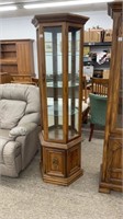 Lighted curio cabinet with 3 glass shelves and