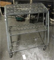 Rolling 3 step ladder. Measures 31" H x 26" W x