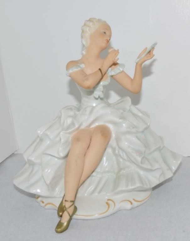 Porcelain lady looking in mirror figurine, 7",