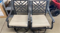 2 outdoor swivel padded black iron chairs