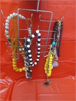 Hanger with misc. costume jewelry necklaces