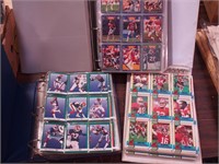 Three binders of football cards