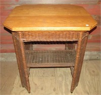 Wicker table with wood top in octagon shape.