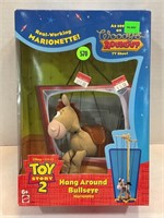 Toy story, two marionette hang around bull’s-eye