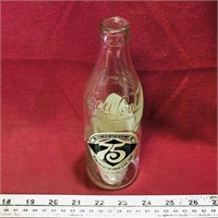 Coca-Cola 75th Anniversary Embossed Glass Bottle