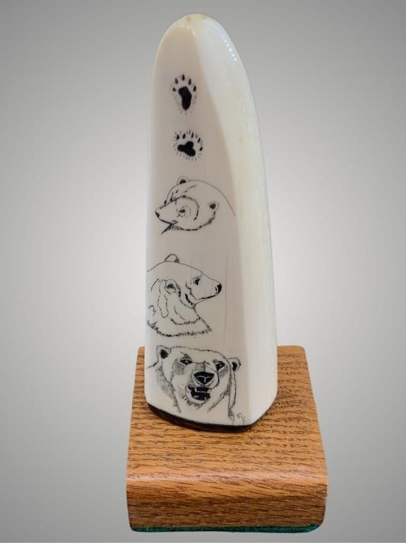 Richard Freeman scrimshaw of several Alaskan anima