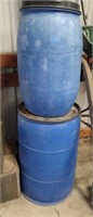 TWO BLUE WATER BARRELS