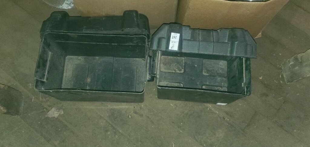 2 plastic battery boxes.
