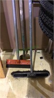 Three hand tools, broom, and two metal edger type