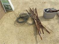 Barb wire and 7 fence posts