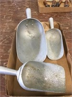 Three metal scoops, various sizes