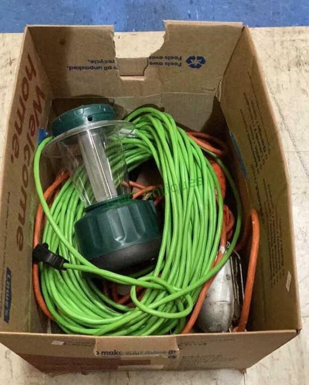 Box contains a long extension cord, a lantern, a