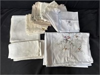 Group of white table linens in box
