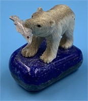 Moose antler carving of a bear and fish on a lapis