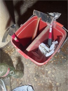 Red bucket with hand tools.
