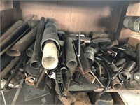 Group of pipes, scrap pieces (under work bench)