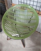 Green plastic with metal frame chair.