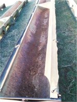 Steel cattle feed bunks on skid (33 ft long)