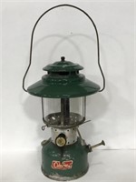 Vintage green Coleman oil lantern with Pyrex glass