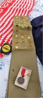 vintage Boy Scout sash with badges and a pin
